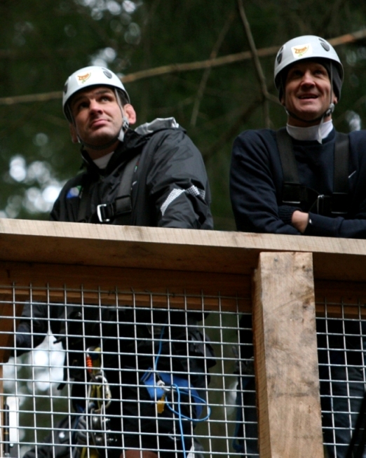 English Rugby Team watching their team mates zipping down the steepest zipline in the world at Ziptrek Ecotours